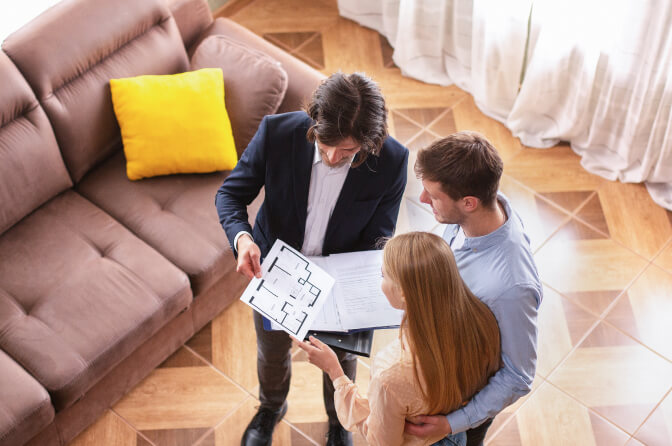 Real estate advisors reviewing a property plan